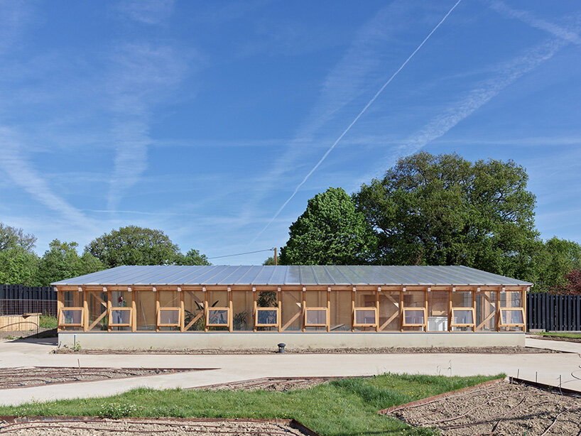 guinee*potin's agro-ecological park revives french site through timber and translucent skins