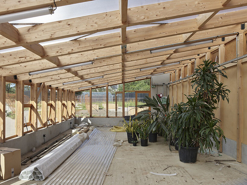 guinee*potin's agro-ecological park revives french site through timber and translucent skins