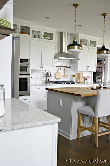 White kitchen cabinets gray island