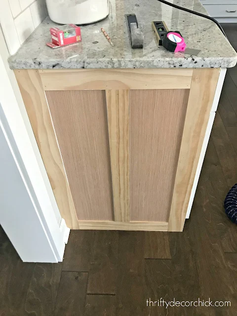 Board and batten look at the end of kitchen cabinets