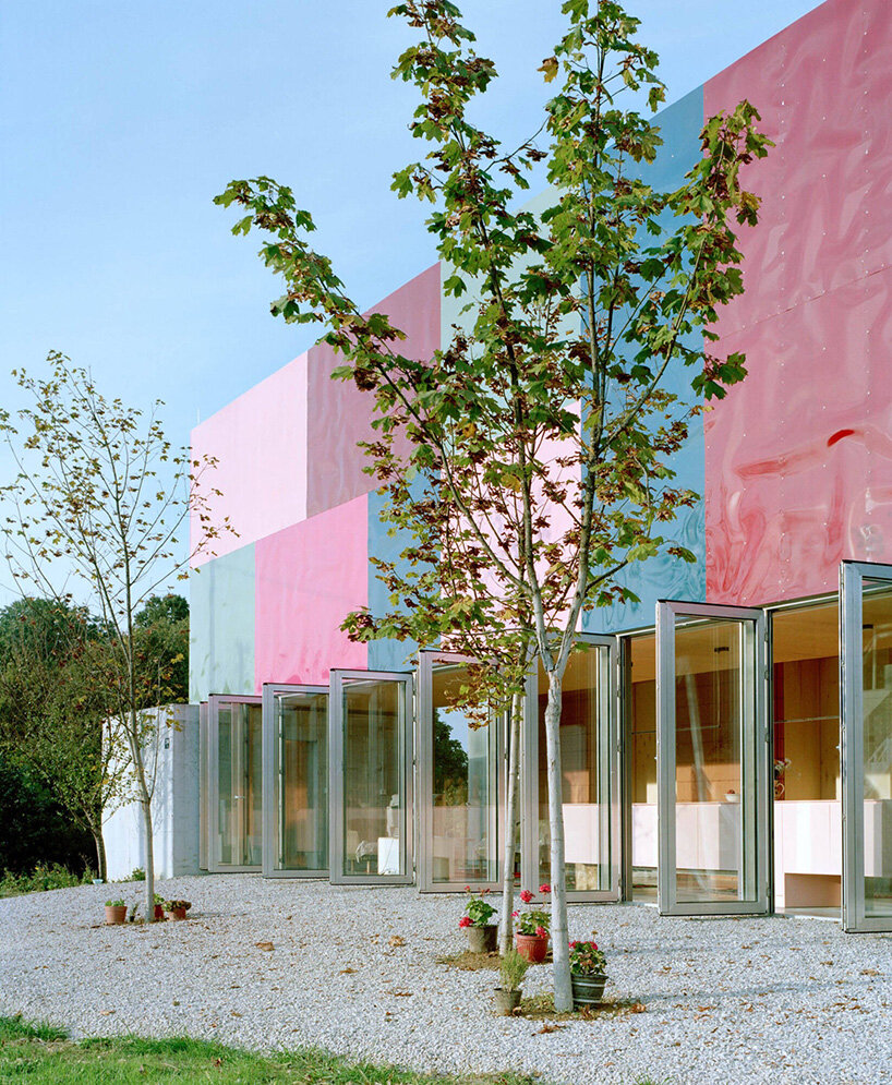 vivid rippled panels envelop TEN's care-based housing for women in bosnia-herzegovina