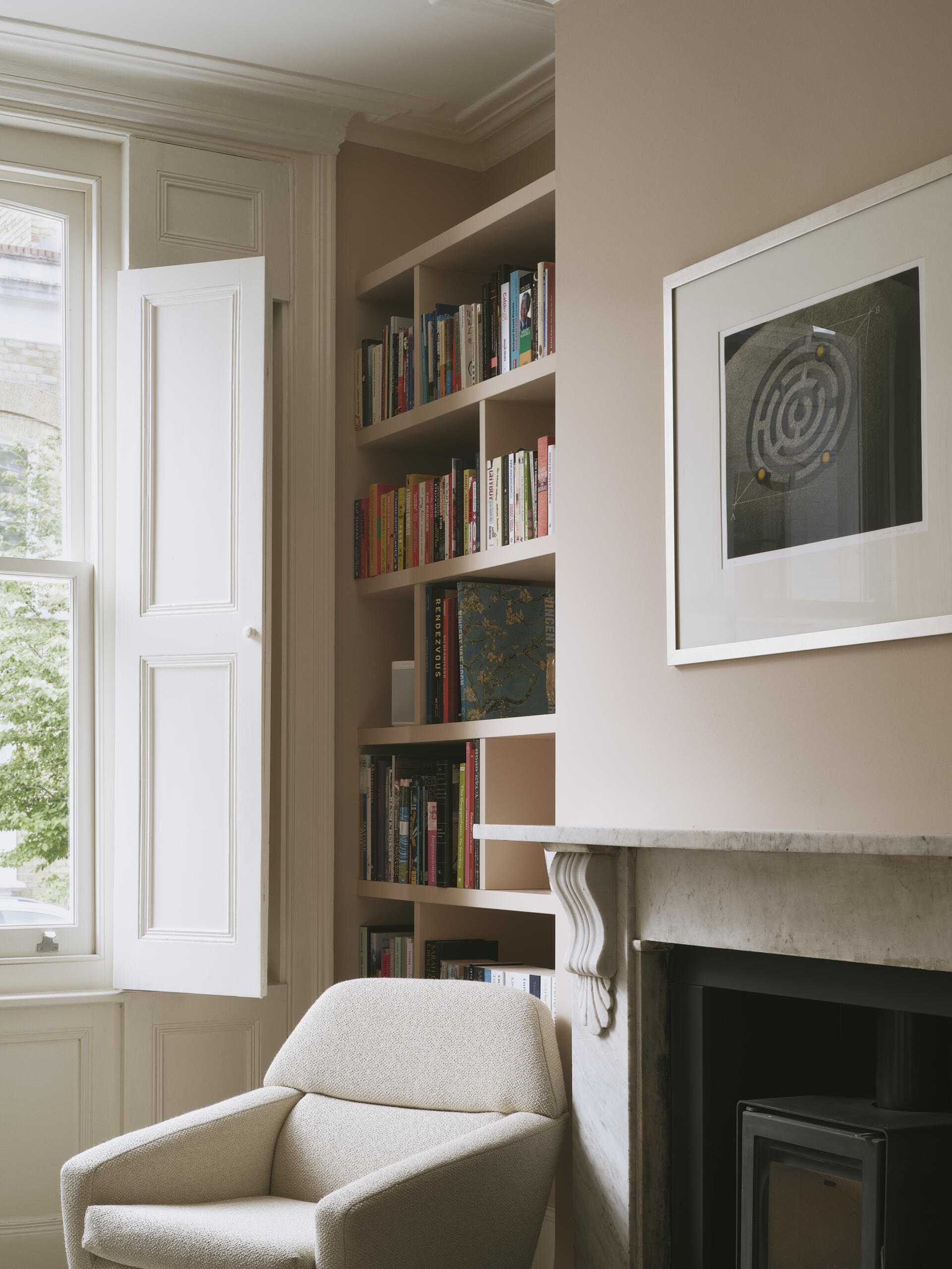 Located toward the front of the house, this original living room, with a built-in bookshelf, retains its character but has been updated with subtle, modern interventions. Victorian details like cornices and fireplaces are preserved, while the palette and finishes bring it in line with the rest of the home’s design.