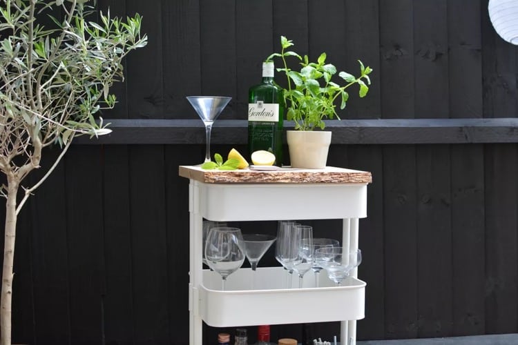 DIYers Swear By These Backyard Ideas Using IKEA Best-Selling Items 31 RASKOG cart as mobile bar cart for backyard entertaining