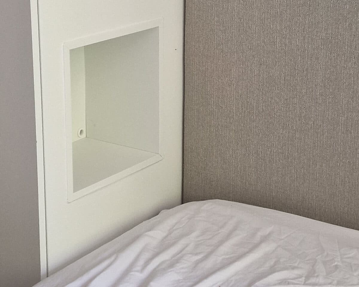 This Clever PAX Wardrobe Hack Solves a Classic Small Bedroom Dilemma 12 EKET shelf unit inserted into PAX frame to create a wardrobe niche that works as a bedside table