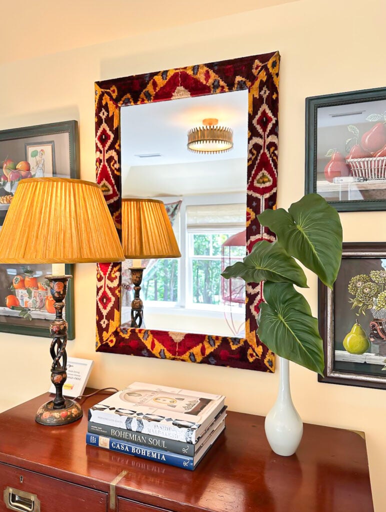 mirror frame covered with fabric in guest room wall 