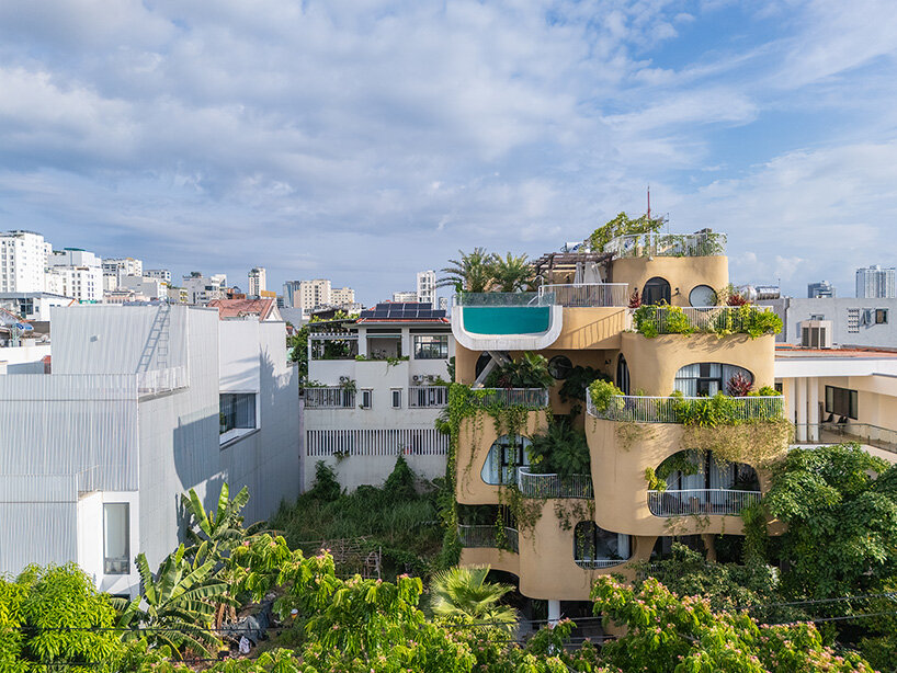 rooftop pool cantilevers from the facade of ho khue architects' hotel in vietnam