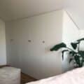Kiss Wasted Space Goodbye With This Low Ceiling Storage Hack 9 sloped ceiling closet hack