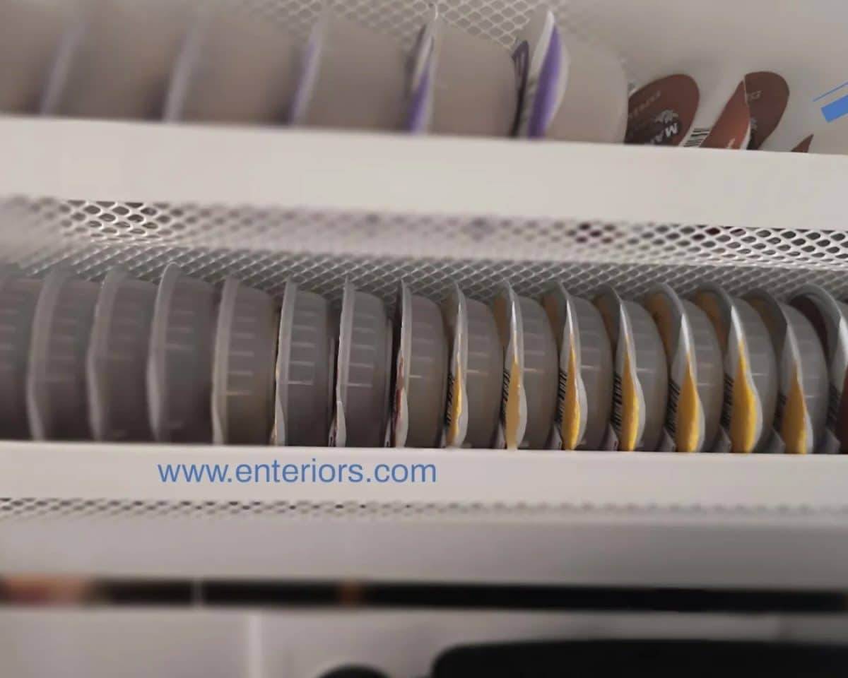 Tassimo coffee pod storage organizer installed at the back of kitchen cabinet 