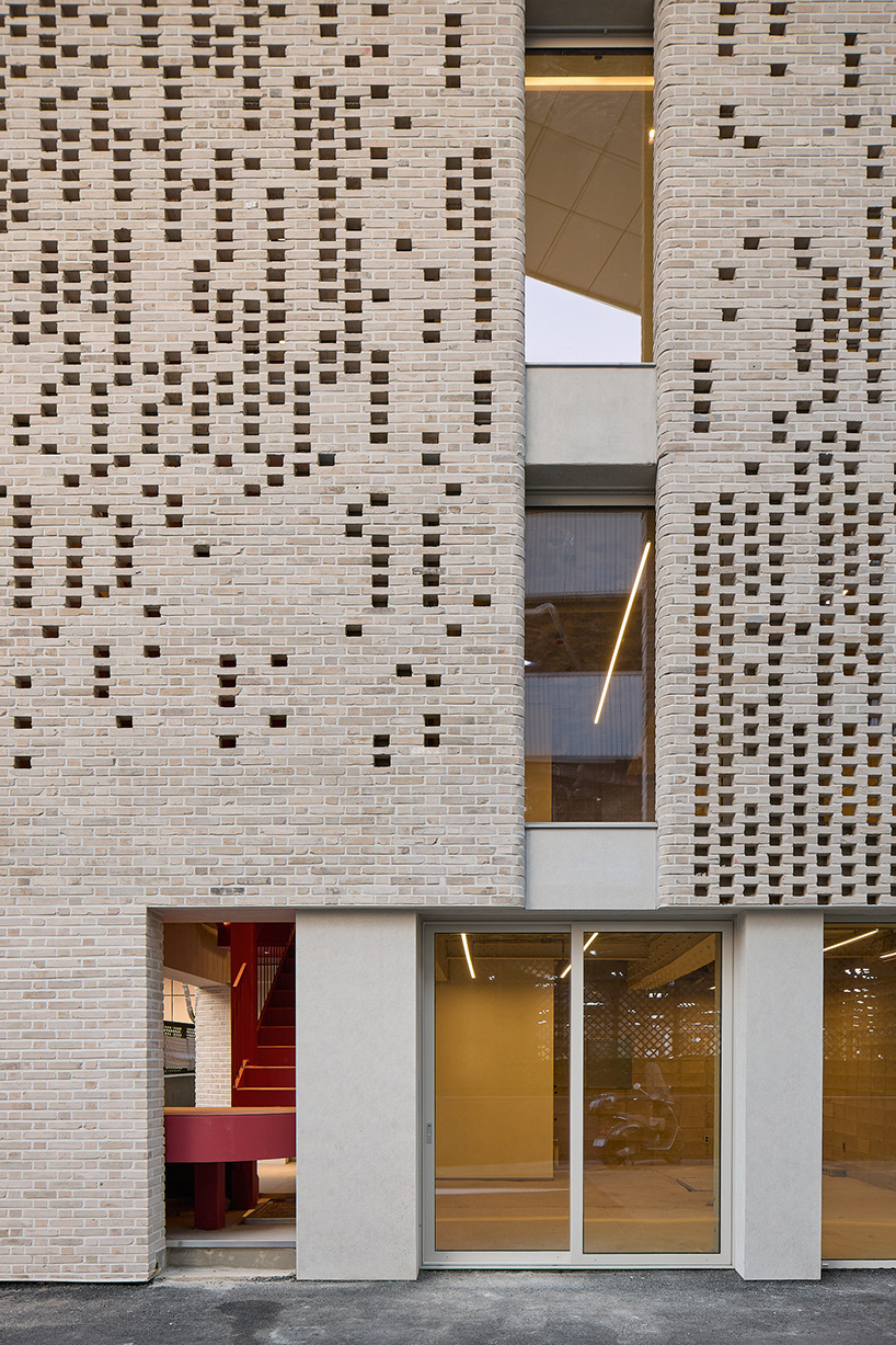 perforated brickwork forms pixelated pattern upon restored seoul building by NOMAL