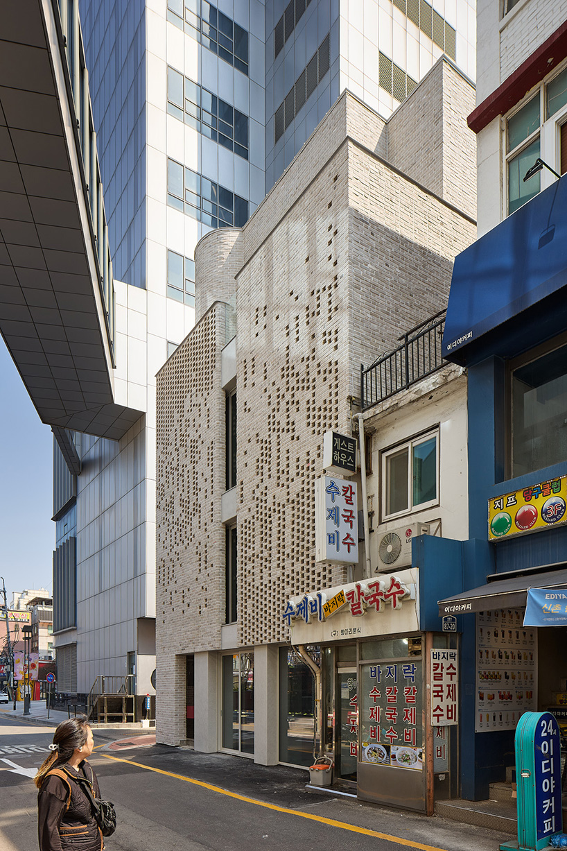 perforated brickwork forms pixelated pattern upon restored seoul building by NOMAL