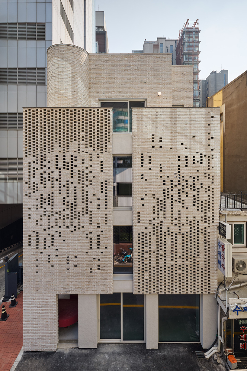 perforated brickwork forms pixelated pattern upon restored seoul building by NOMAL