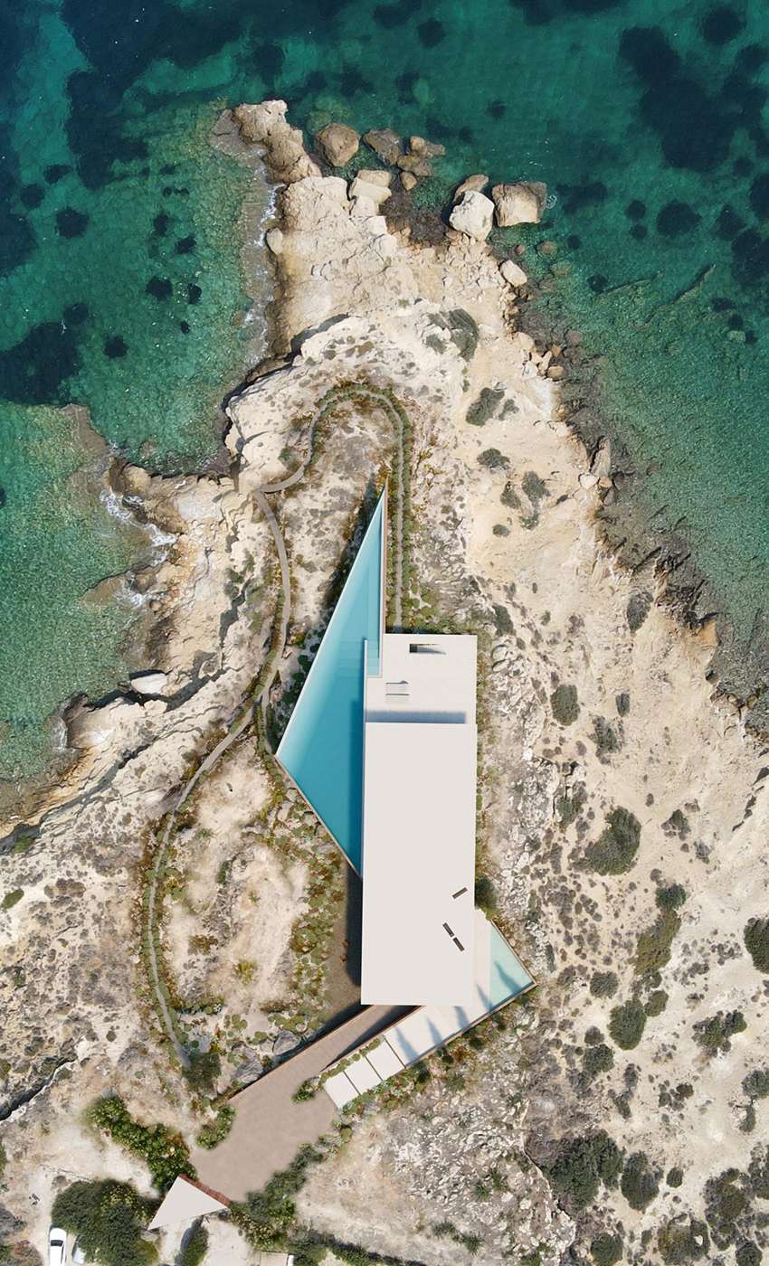 summer residence's sharp geometry emerges from greek seaside slope