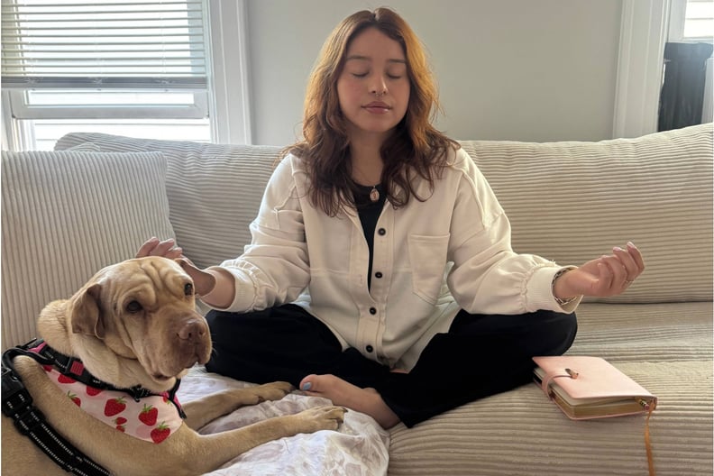 a photo of a woman meditating for eczema stress